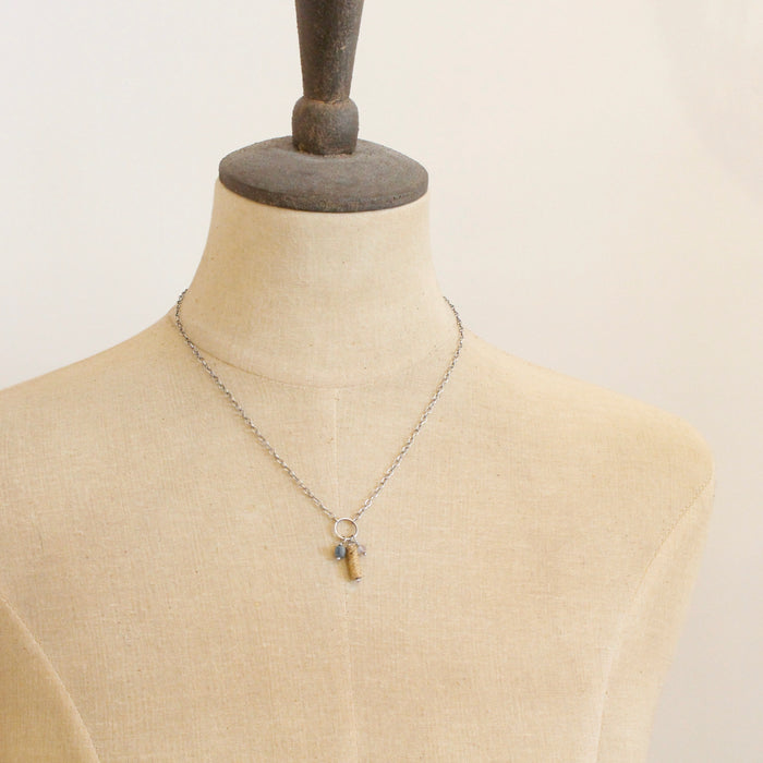 A mannequin wearing the oasis sydney charm necklace