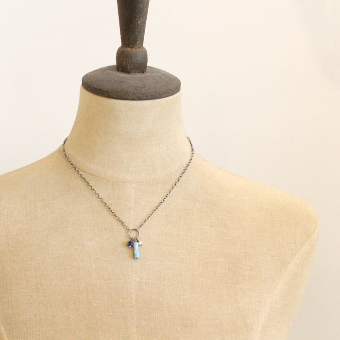 A mannequin wearing the meadow sydney charm necklace