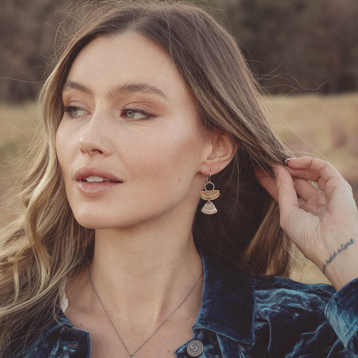 A model wearing the asmi mixed duo earrings