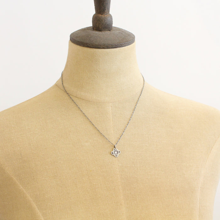 A mannequin wearing the mini talara necklace