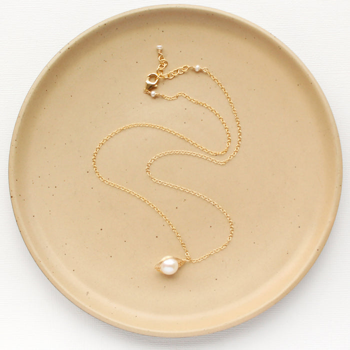 The perfect pearl gold necklace showing the adjustable lobster clasp closure