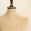 A mannequin wearing the floating silver heart necklace