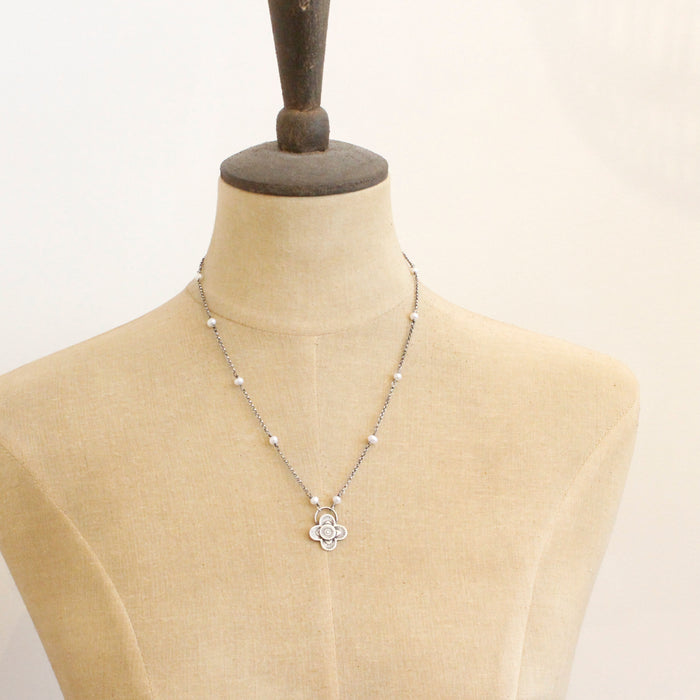 A mannequin wearing the layered talara pearl necklace