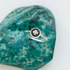 The clover stacking ring styled on a blue stone