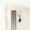 A perfect wrap onyx earring neck to a ruler for size reference