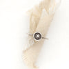 The southwest sunburst ring styled on tan linen