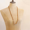 The layered desert adjustable leather necklace styled on a mannequin to show the longer length