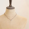 The knotted phosphosiderite mini cactus flower necklace styled on a mannequin to show the length