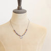 The layered cactus flower sapphire necklace styled on a mannequin to show the length