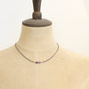 A mannequin wearing the sydney lepidolite necklace
