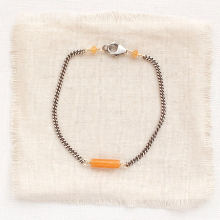 The sydney orange aventurine bracelet styled on tan linen