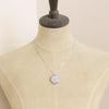 A mannequin wearing the amethyst stalactite flower necklace