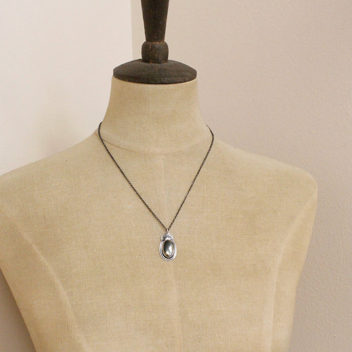 A mannequin wearing the apache gold necklace