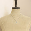 A mannequin wearing the beaded sapphire necklace