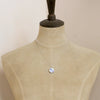A mannequin wearing the blue bloom vintage plate necklace