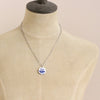 A mannequin wearing the blue sprig vintage plate necklace