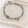 The zircon and labradorite roma bracelet styled on tan linen