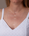 A graphic showing the different lengths of chains on a woman's chest