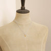 A mannequin wearing the citrine drop silver necklace