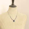A mannequin wearing the cleo sapphire necklace
