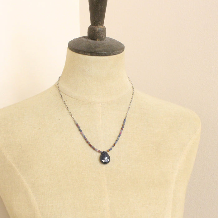 A mannequin wearing the cleo sapphire necklace