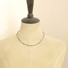 A mannequin wearing the dainty sapphire necklace