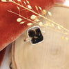 The dendritic agate ring styled on wood with orange velvet and dried grass