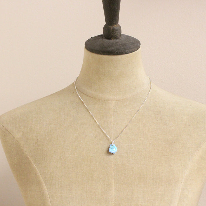 A mannequin wearing the golden hills turquoise necklace