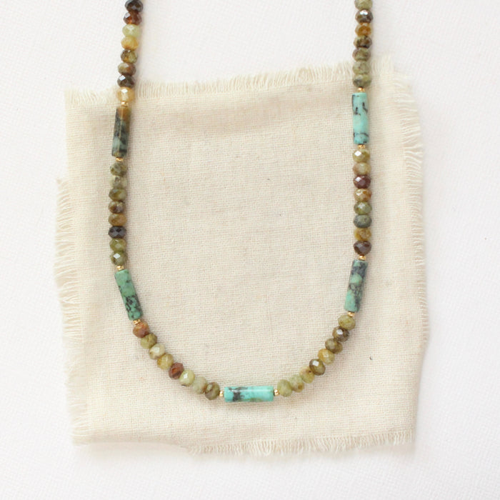 The beaded lana necklace styled on tan linen