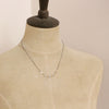 A mannequin wearing the mixed metal herkimer diamond necklace