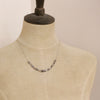 A mannequin wearing the herkimer diamond collar necklace