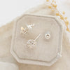 The silver wrapped herkimer diamond post earrings styled on a velvet box to show the posts and comfort clutch ear backs