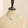 A mannequin wearing the kingman turquoise and opal necklace