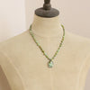 A mannequin wearing the knotted elisa and hubei turquoise necklace