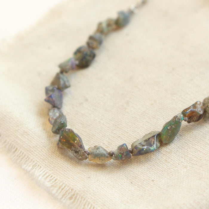 A close up photo of the raw opals in the knotted opal necklace