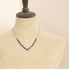 A mannequin wearing the knotted sodalite mini cactus flower necklace