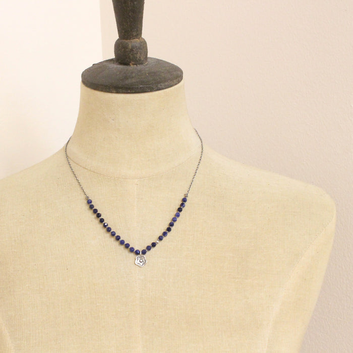 A mannequin wearing the knotted sodalite mini cactus flower necklace