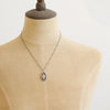 A mannequin wearing the layered sprout necklace