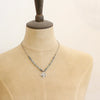 A mannequin wearing the layered talara knotted kyanite necklace
