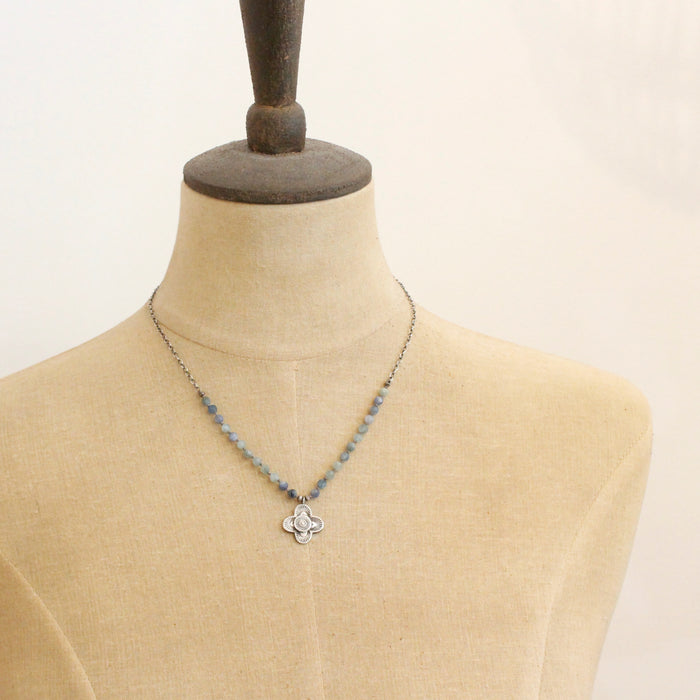 A mannequin wearing the layered talara knotted kyanite necklace