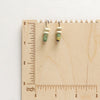 The turquoise and lemon chrysoprase lobe hugger earrings on a wooden ruler to show size reference
