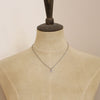 A mannequin wearing the bronze leaf necklace