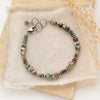 The lona bracelet styled on a tan rock with linen and dried grass