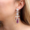 The maximalist purple spiny oyster earrings being worn