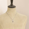 A mannequin wearing the mini cactus flower sodalite lantern necklace
