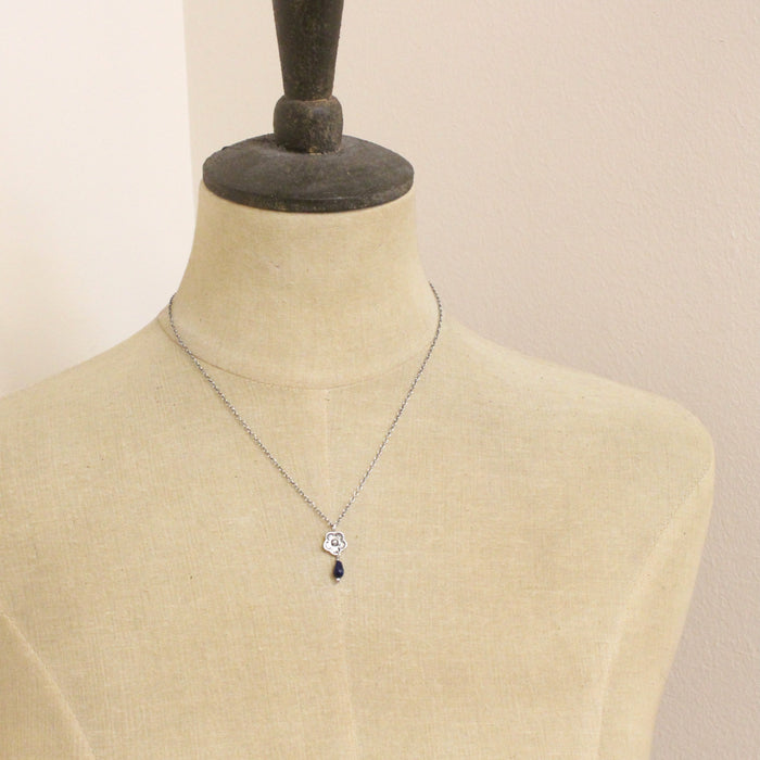 A mannequin wearing the mini cactus flower sodalite lantern necklace