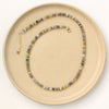 The mixed opal necklace styled on a tan plate to show the adjustable lobster clasp closure