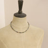 A mannequin wearing the mixed opal necklace