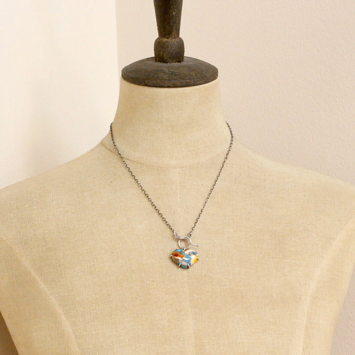 A mannequin wearing the mohave turquoise heart necklace