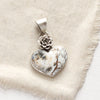 The mohave white buffalo turquoise heart and succulent pendant option styled on tan linen
